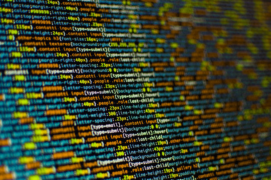 Software development. Software source code. Programming code. Writing programming code on laptop.