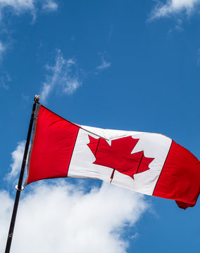 Canadian flaf blowing in wind