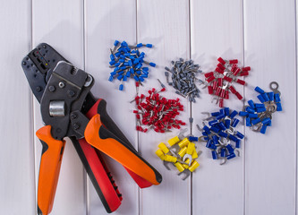 Cable lug in different colors and sizes on a white background. Electric terminals of different...