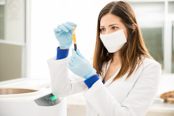 Woman analyzing some blood in a lab