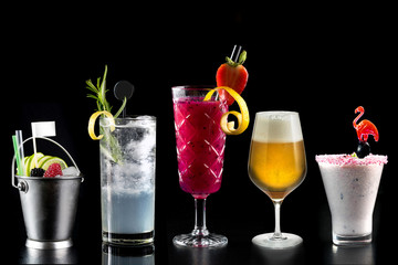 modern rustic selection of cocktails drinks alcohol at bar counter with defocused background various colours glass