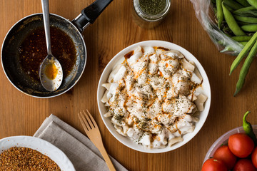 Turkish Manti Manlama / Ravioli with yogurt and fried butter sauce.