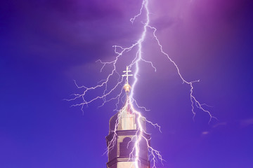 top of church tower with lightning