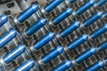 equipment for the manufacture of preforms for plastic bottles. PET production. close-up of a flask for plastic bottles 