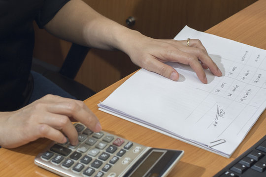 recheck document or data before approve document by calculator, business concept