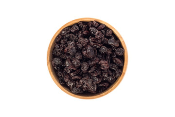 Dried raisins in wooden cup on white background.