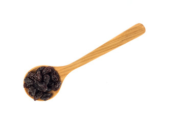 Dried raisins in wooden spoon on white background.