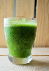 Green Juice on a Wood Table. Portrait version