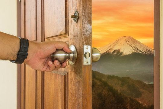 abstract scene of man open the wood door to mount fuji - can use to display or montage on product