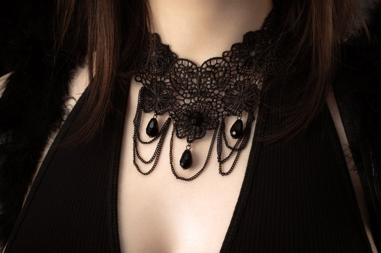 beautiful black ornament on neck of girl