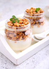 healthy breakfast: yogurt with muesli in jars