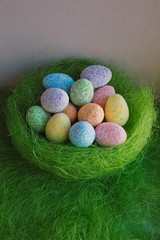 Easter eggs on green background