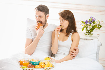 Relaxed Couple in Bed in bedroom at home