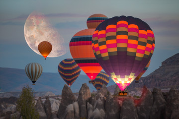 Hot air balloon flying over spectacular Cappadocia "Elements of this image furnished by NASA"