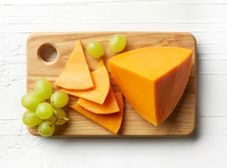 Foto op Plexiglas Piece and slices of cheddar cheese © baibaz
