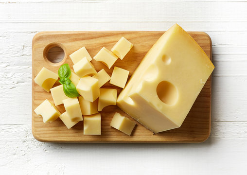 Piece and cubes of swiss cheese