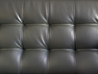 Background: soft leather sofa close up