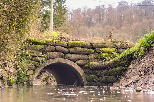 Man Made bridge across a shallow stream