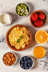Healthy breakfast - bowl of corn flakes, berries and fruit