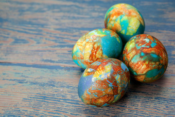 Colorful easter egg on wood background.