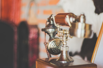 Fototapeta na wymiar Vintage of telephone on the counter.