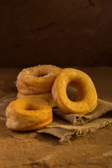 Donuts with sugar on a dark background. Selective focus.