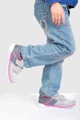 Young girl standing on one foot