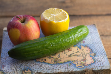 Fruits and vegetables near the old book
