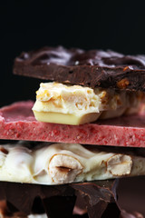 Melting chocolate and diffrent bars - stack and chips with choco