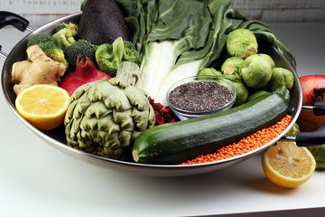 Vegetables, fruit, seeds, cereals, beans, spices, superfoods, herbs, condiment in silver pan for vegan, gluten free, allergy-friendly, clean eating and raw diet.