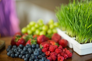 Fruits and herbs on the counter at health grocery shop 