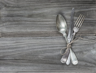 Vintage cutlery on wooden boards