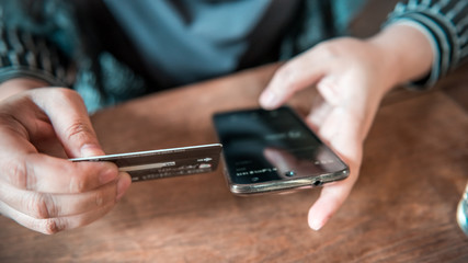 Payment home online shopping with a credit card and smartphone.
