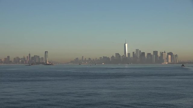 Golden sunset Manhattan Downtown panorama skyscrapers, New York City NYC Skyline. Apartments Buildings. The skyline of New York City at Sunset filmed from the the New Jersey.