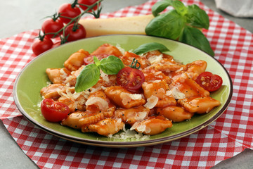 Ravioli with tomato sauce and basil