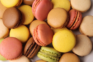 A french sweet delicacy, colourful macaroons variety closeup. Background Texture
