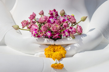 Flowers in White Buddha hands