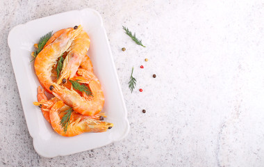 shrimp and dill in white plate on a white background