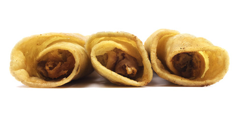 Chicken taquitos isolated on a white background.
