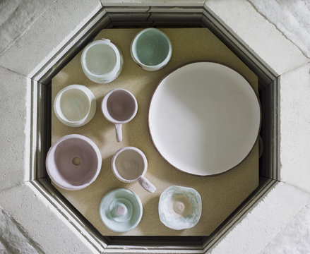 Overhead view of ceramics on table in workshop