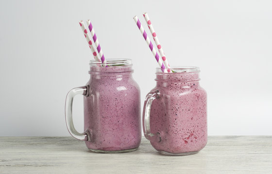 Raspberry and blueberry smoothie with yoghurt and protein