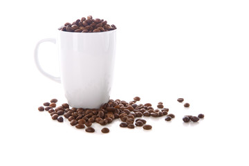 Fototapeta na wymiar White cup and coffee beans