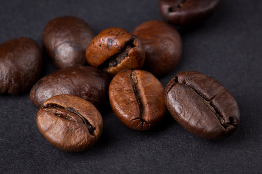Coffee beans on a dark background © Oleksandr