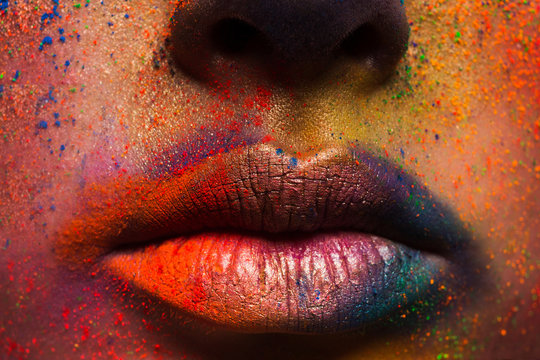 Lips of model with colorful art make-up, holi colors
