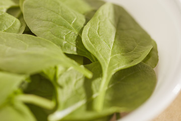Fresh, raw, baby spinach leaves.