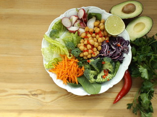 Bowl of Buddha. The concept of healthy vegetarian food. Fresh raw vegetables and boiled chickpeas.
