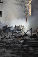 Car overturned and burned
Street damage caused during a student strike in Santiago's Downtown,...