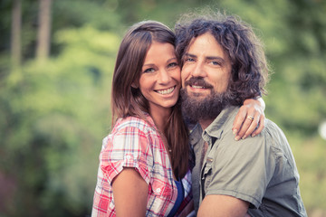 Fototapeta premium couple at the park with dog