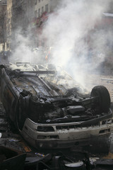 Car overturned and burned
Street damage caused during a student strike in Santiago's Downtown,...