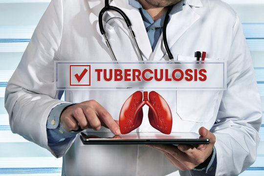 Pneumologist Working With Tablet In Hands In The Lab With Text Tuberculosis / Doctor Holding Tablet Pc In The Clinic With Text Tuberculosis